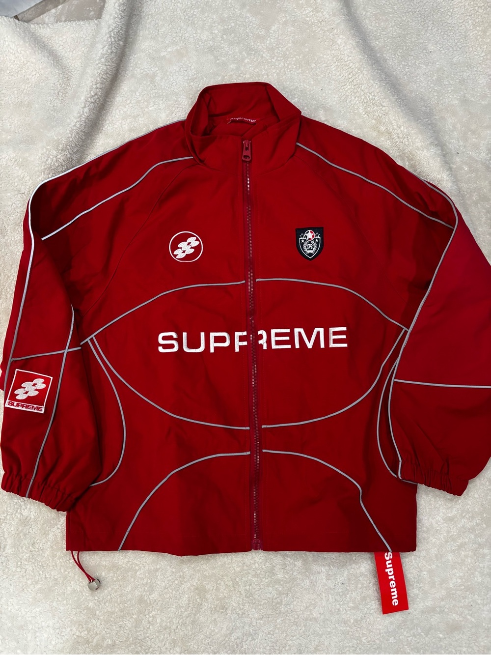 Supreme Red windbreaker-Style Jacket with White Logo only available tell Friday